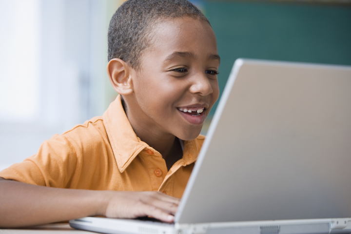 Child on computer. Child on computer.