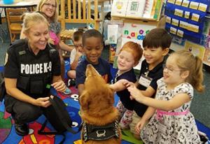 PCS Police K-9 team meet with students.