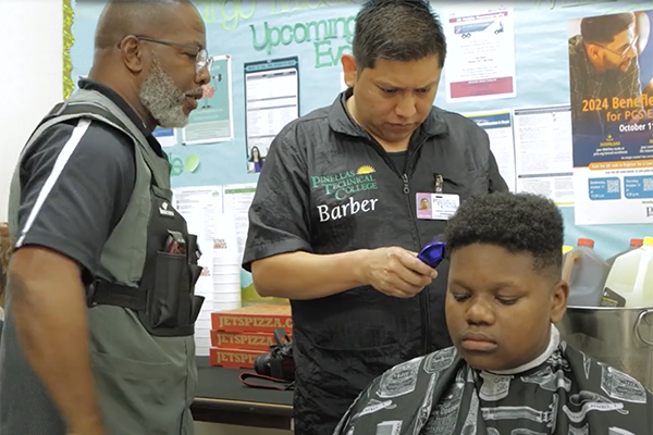 Pinellas Technical College barber students style at Largo Middle