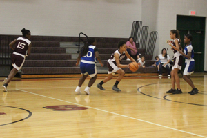 Lady Trojans squeak by Meadowlawn
