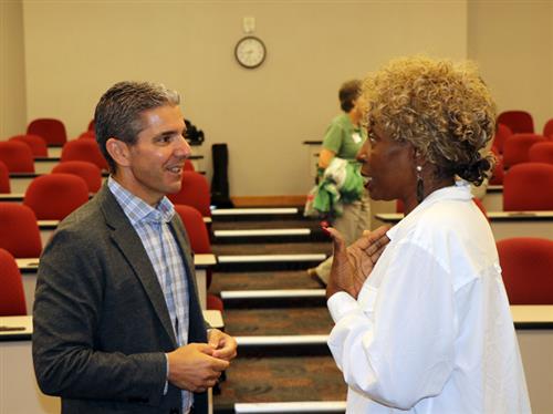 Dr. Joseph D. Carella speaks with a mentor. 