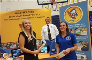 Principal Kalach and his staff welcome families to the fair 