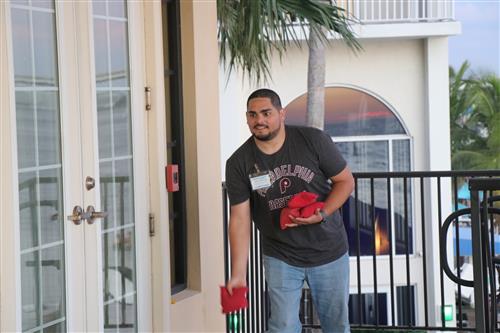 New teacher playing cornhole.