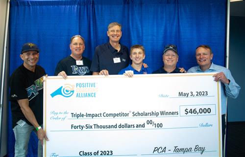 Devin Daughtry with scholarship check