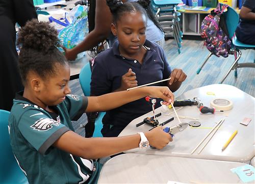 Students in the 21st Century iClass After School program are engaging activities. 