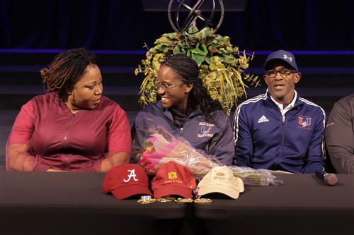 Rachael with her parents