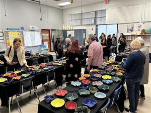 Selecting bowls at the Empty Bowls fundraiser