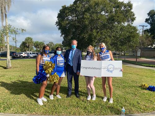 Dr. Grego and Largo cheerleaders 