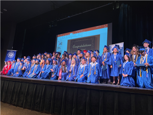Early college graduates on stage
