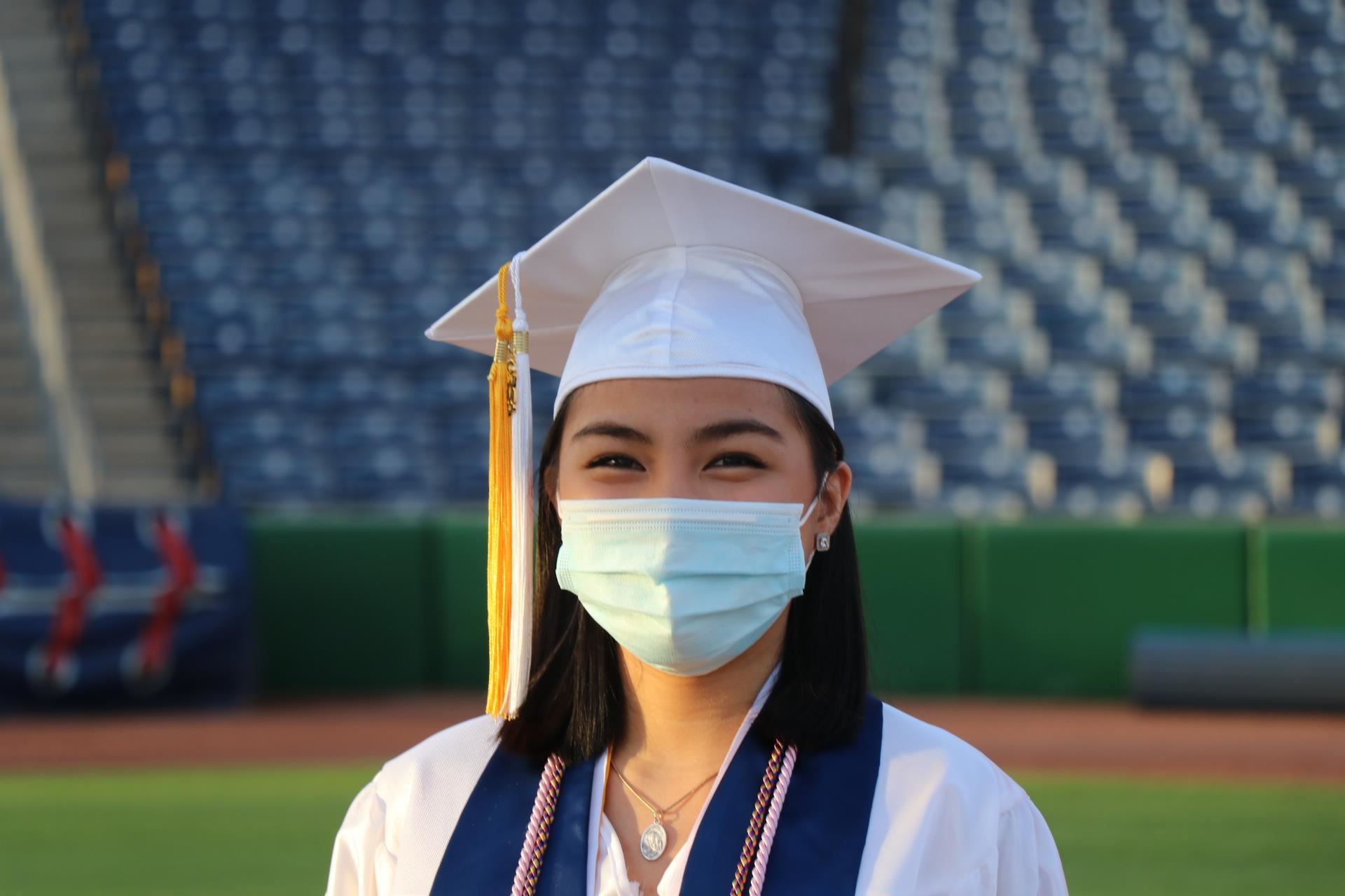 Girl graduate in cap and gown