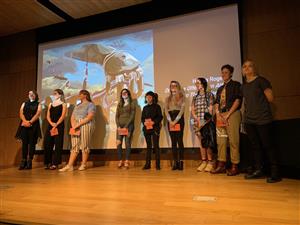 Students on stage at the Surreal Exhibit 