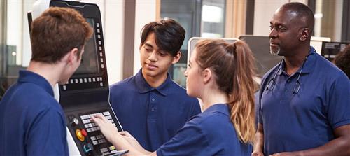 Three young people and a mentor using equipment 