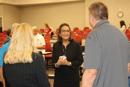 Michelle Roberge, PCSB volunteer coordinator, speaks with mentors 