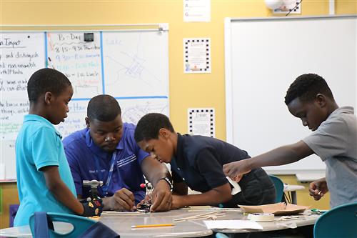 Students in the 21st Century iClass After School program are engaging activities. 