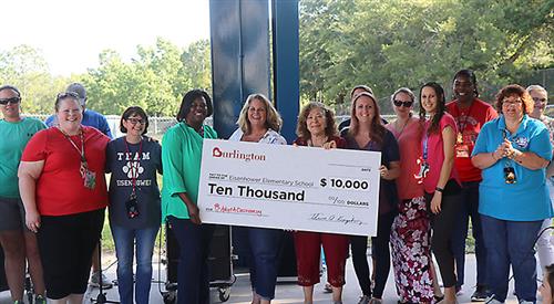 Eisenhower Elementary receives 10,000 check from Burlington Stores. 