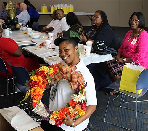 Bus driver wins door prize to luncheon. 