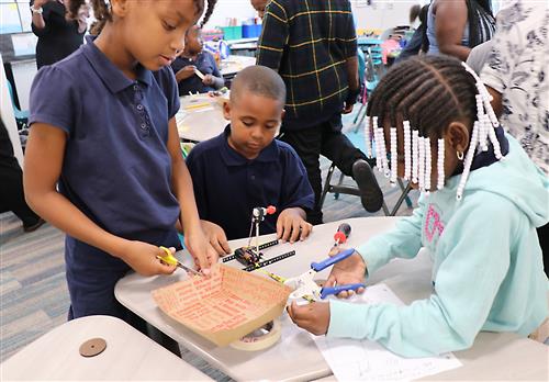 Students in the 21st Century iClass After School program are engaging activities. 