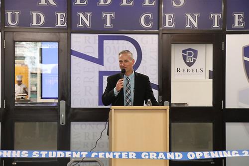 Principal Floria speaks before the opening of new center. 