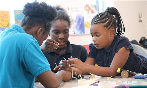 Students in the 21st Century iClass After School program are engaging activities. 