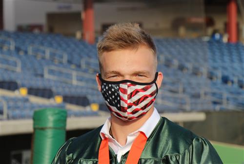 Seminole High graduate with American flag mask. 