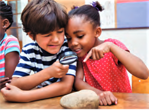 Children examining a rock 