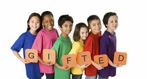 Students holding the word Gifted  