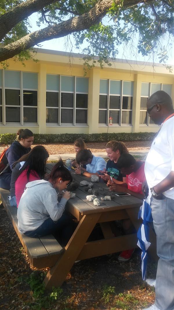 Students eating foods from Maximo's Edible Peace Patch