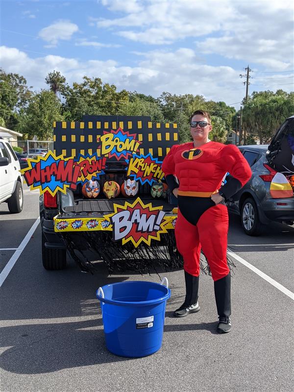 Teachers Showing Off Their Costumes at Trunk-or-Treat