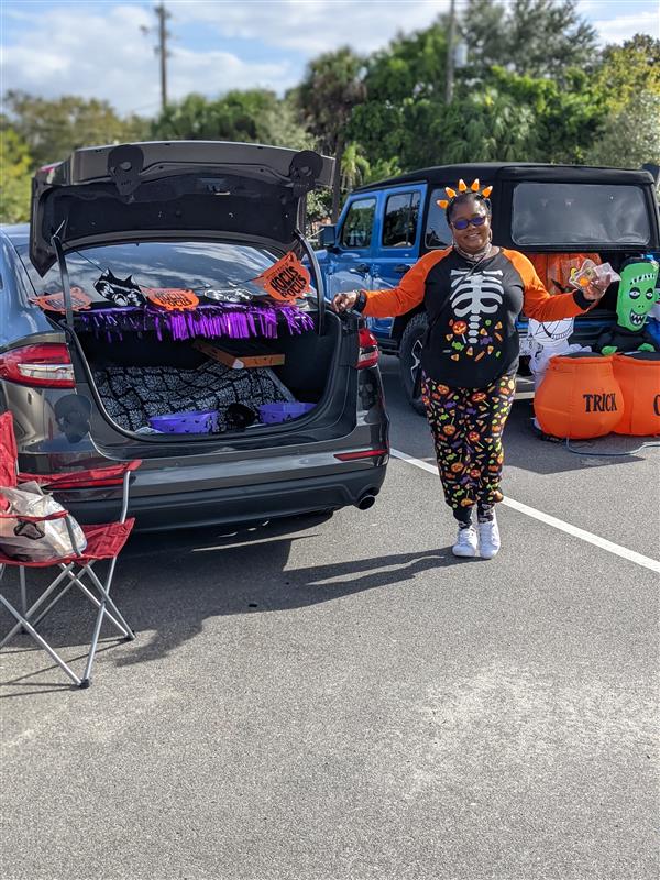 Teachers Showing Off Their Costumes at Trunk-or-Treat