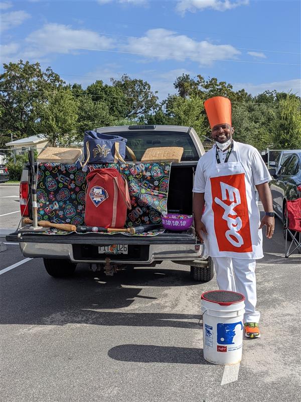 Teachers Showing Off Their Costumes at Trunk-or-Treat