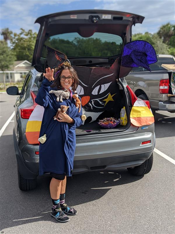 Teachers Showing Off Their Costumes at Trunk-or-Treat