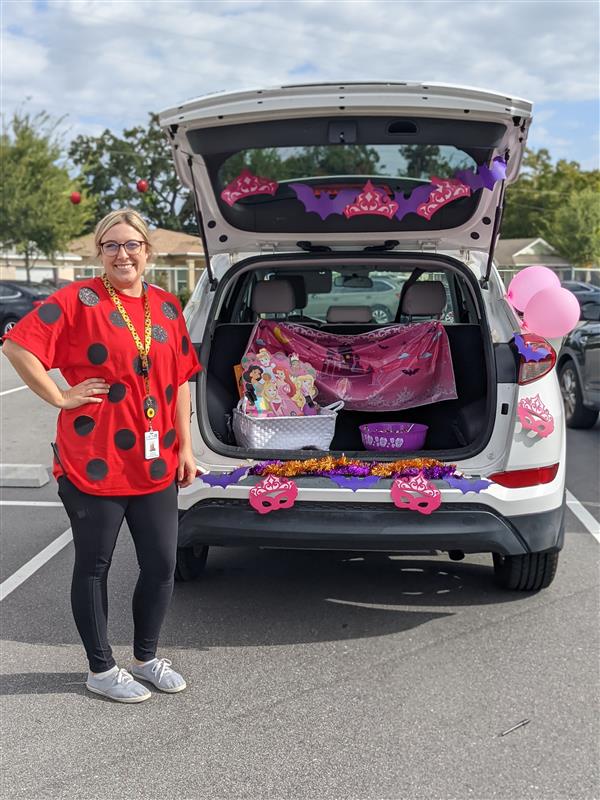 Teachers Showing Off Their Costumes at Trunk-or-Treat