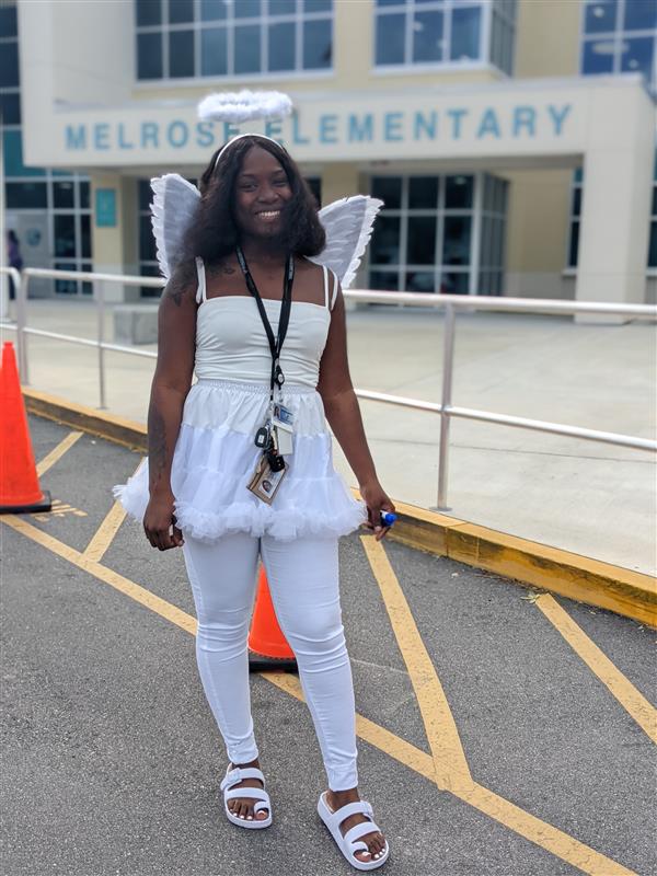 Teachers Showing Off Their Costumes at Trunk-or-Treat