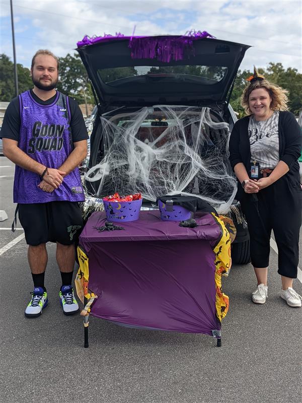 Teachers Showing Off Their Costumes at Trunk-or-Treat