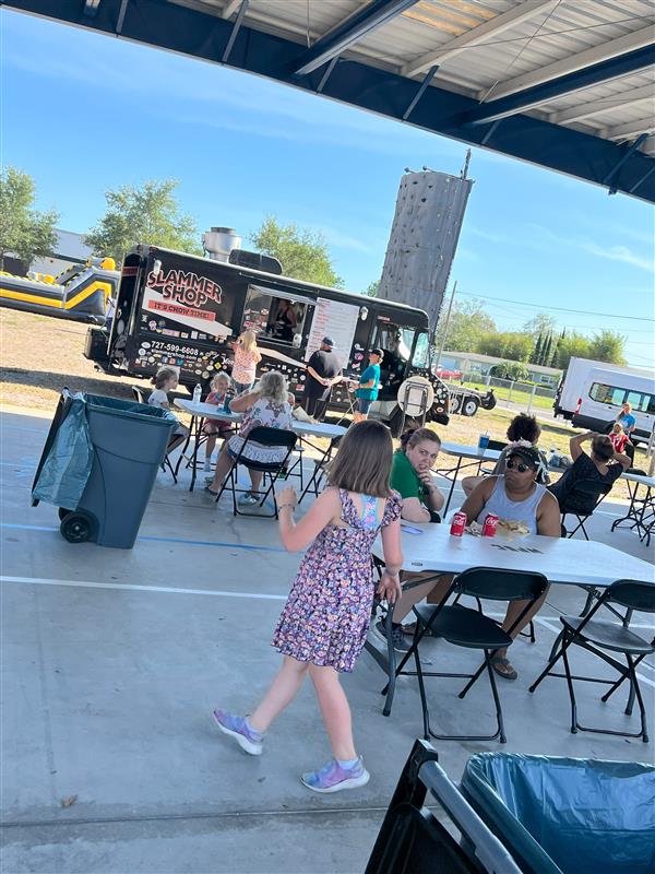 Families enjoying the food truck