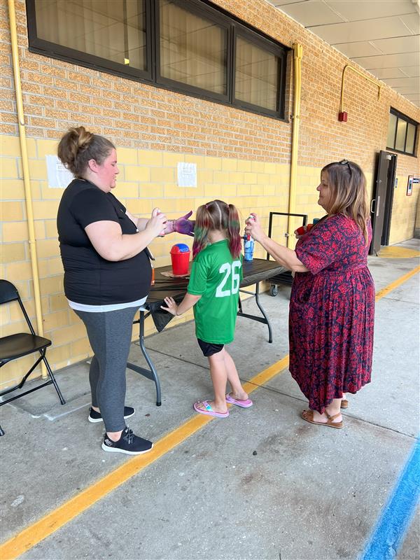 Mrs. Pitts & Mrs. Ford dying a students hair