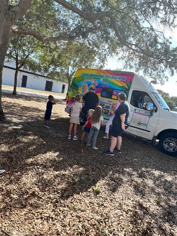 Students cooling down with a tasty treat from Mz Sno Biz!