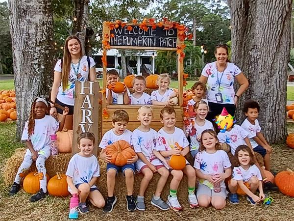 Kindergarten students at San Jose Elementary made class t shirts by painting hand prints on their shirts. They then went on a nature walk through Hammock Park to the pumpkin patch.