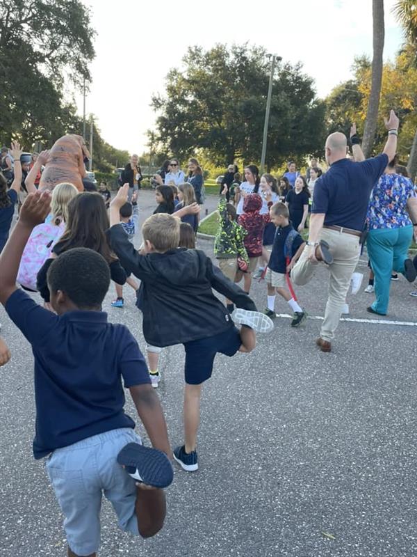 Mrs. Bigman leads in warm-ups & stretches before the big walk!