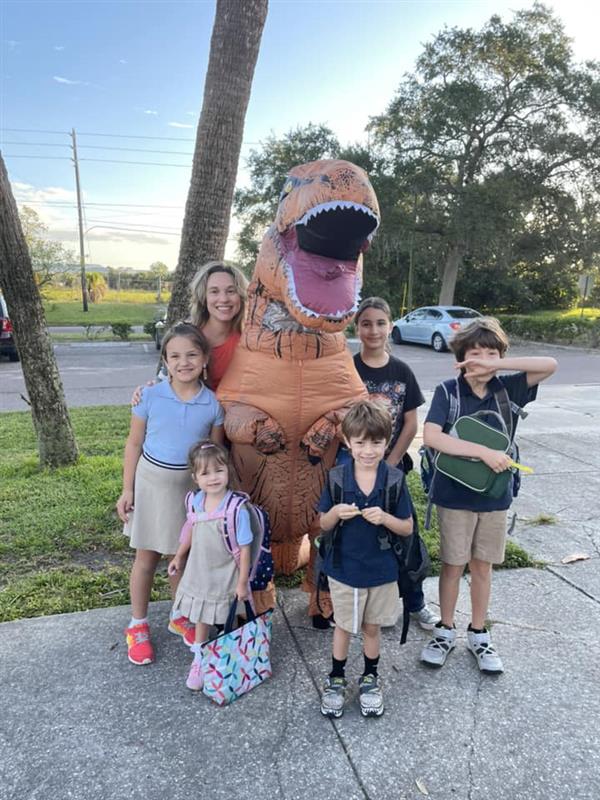 T-Rex has a photo op with Azalea Families.