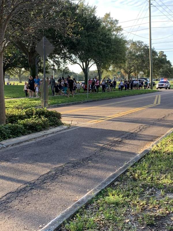 Families walk to school.
