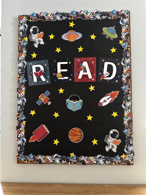 Board with the word read and space decorations