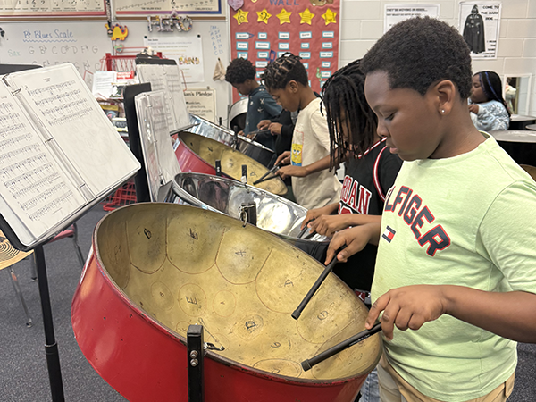 Perkins Elementary Steel Drum Band is practicing for a banging performance.