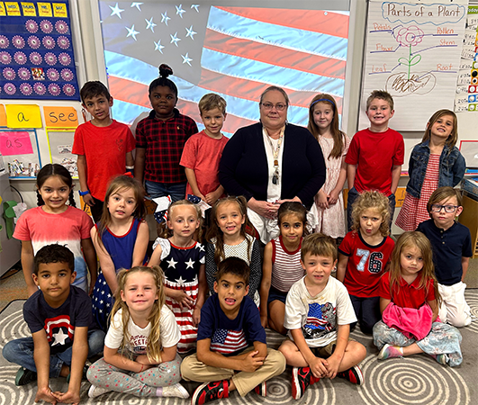 Mrs. Hill's Kindergarten class at Orange Grove Elementary celebrated America at the Patriotic concert led by Music Teacher Mr. Polston.