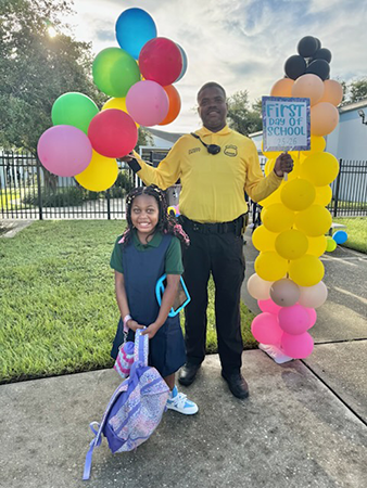 Student and SRO on the first day of school.