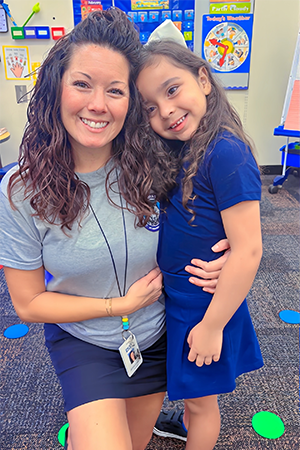 Student and teacher on the first day of school.