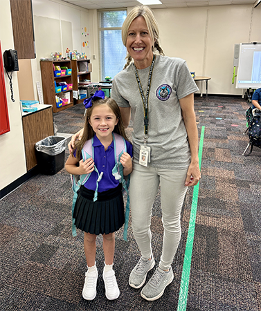 Student and teacher on the first day of school.